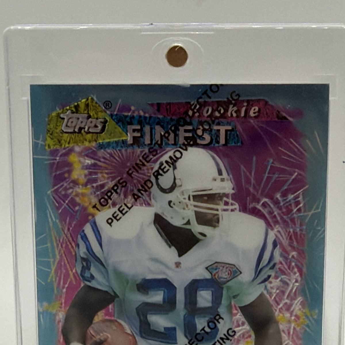 Close-up of Marshall Faulk in his Colts uniform with colorful Finest background and protective coating