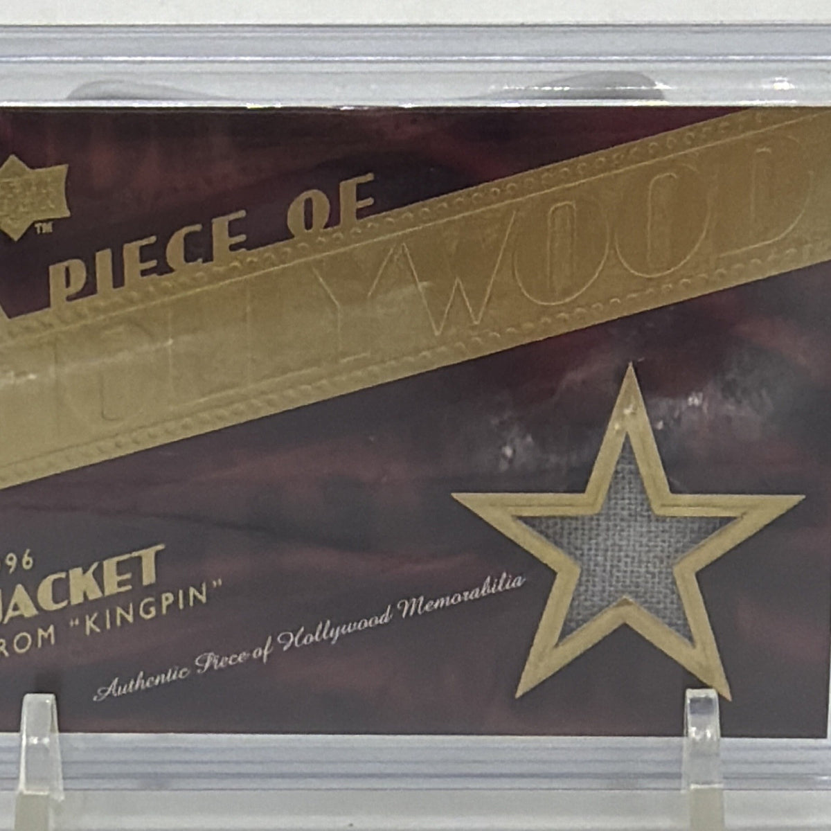Front detail of Upper Deck #HM-24 featuring jacket memorabilia from Kingpin
