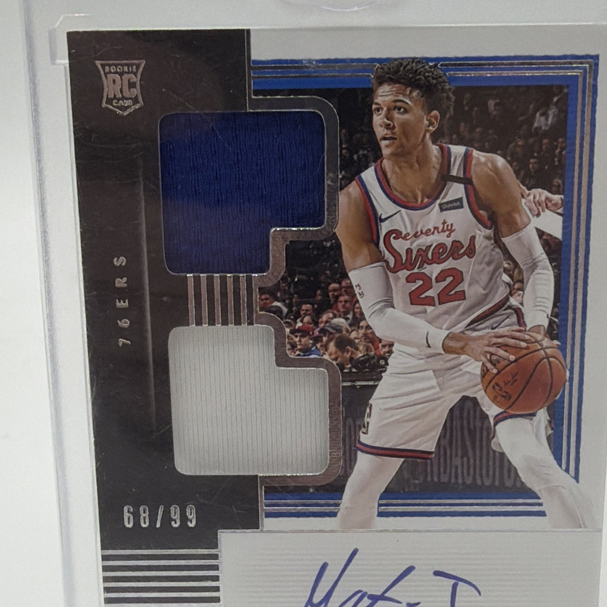 Front detail of Matisse Thybulle Rookie Dual Jersey Autographs card with blue and white memorabilia swatches