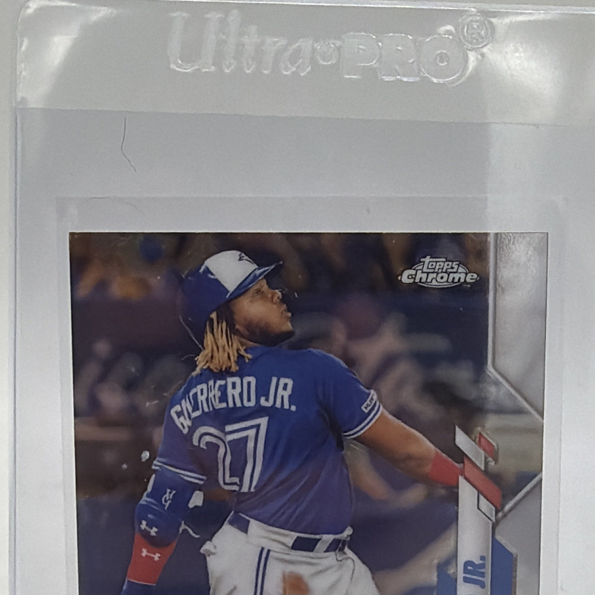 Close-up of upper front of Vladimir Guerrero Jr. Topps Chrome baseball card showing batting pose and Chrome finish