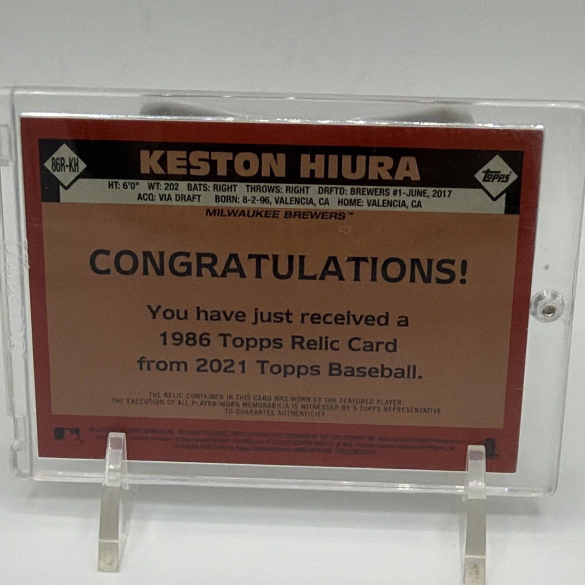 Reverse of 2021 Topps Keston Hiura #86R-KH baseball relic card with memorabilia statement