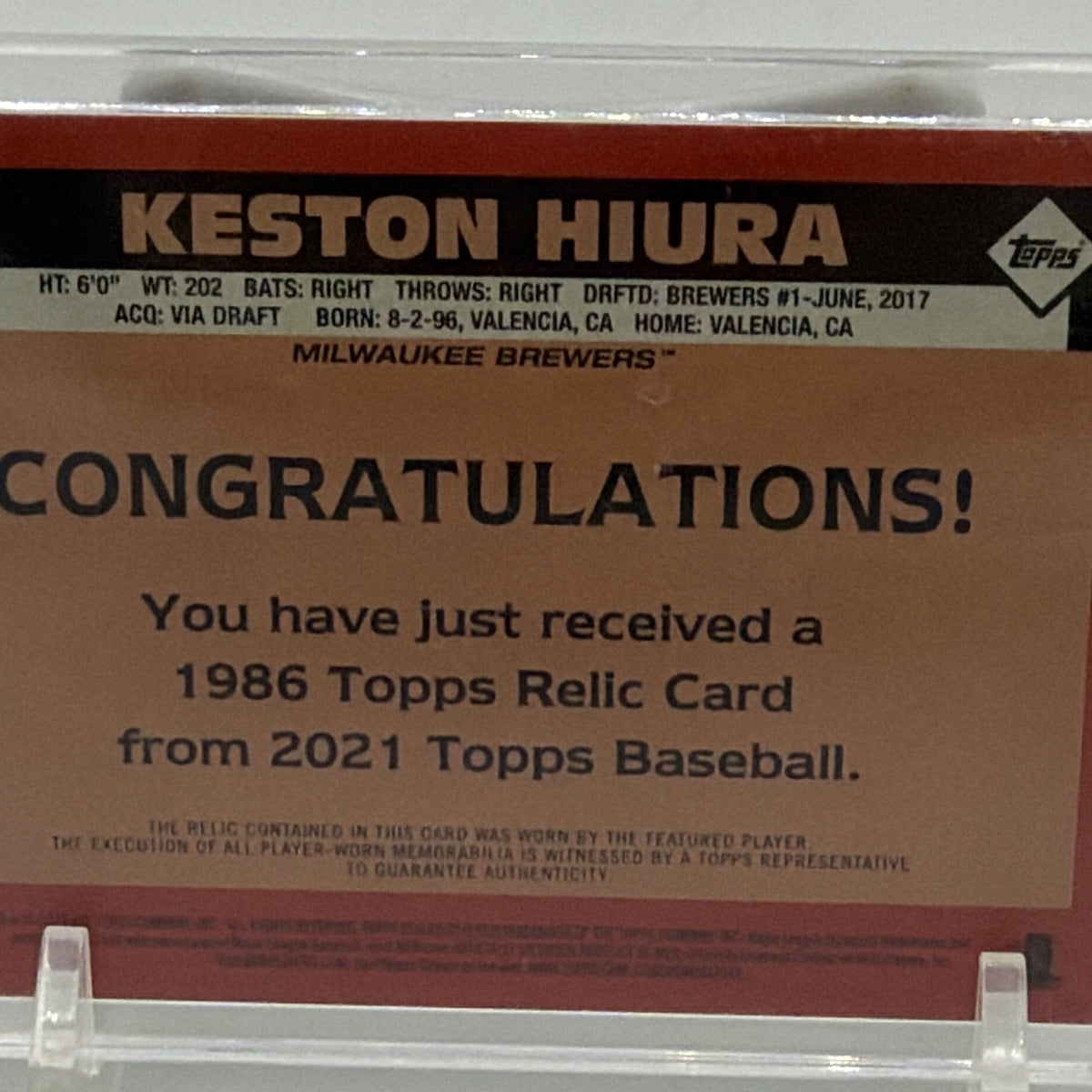 Close-up of Keston Hiura card identification and memorabilia information on reverse