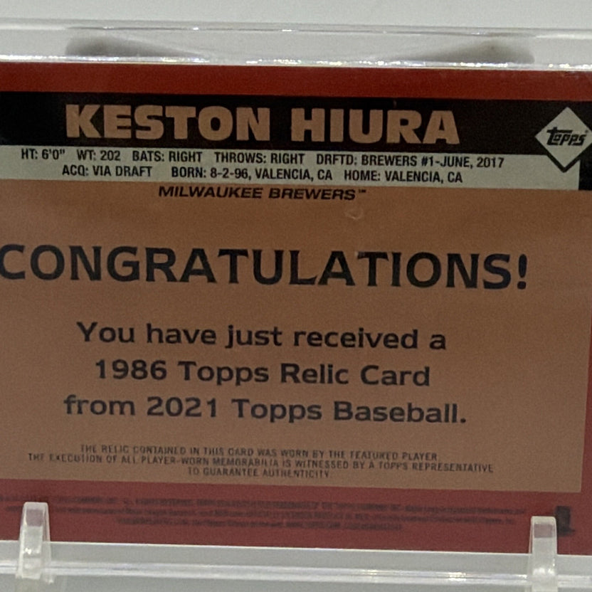 Close-up of Keston Hiura card identification and memorabilia information on reverse