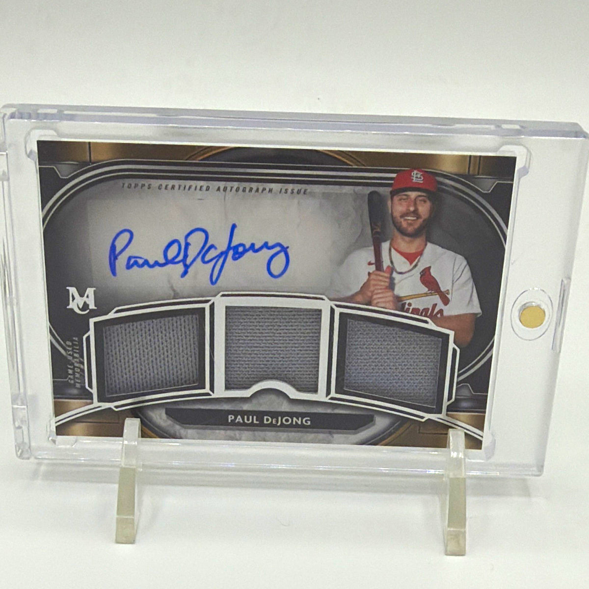 Front of 2021 Topps Museum Collection Paul DeJong triple relic autograph #SPTRA-PD numbered 128/199