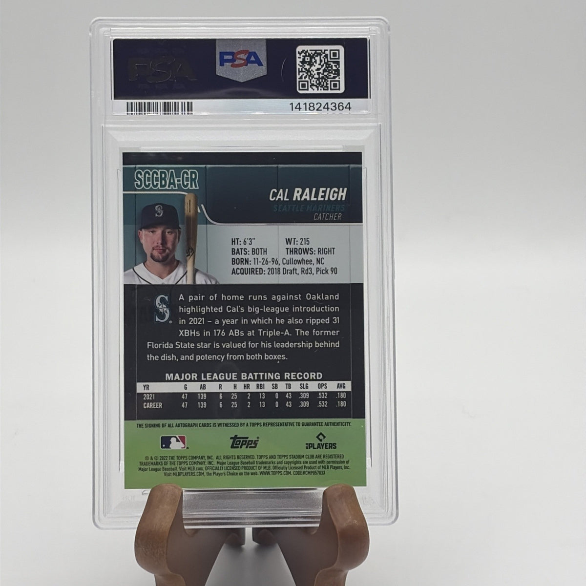 Back of a PSA-graded 2022 Topps Stadium Club Chrome Cal Raleigh rookie autograph card showing player biography and certification.