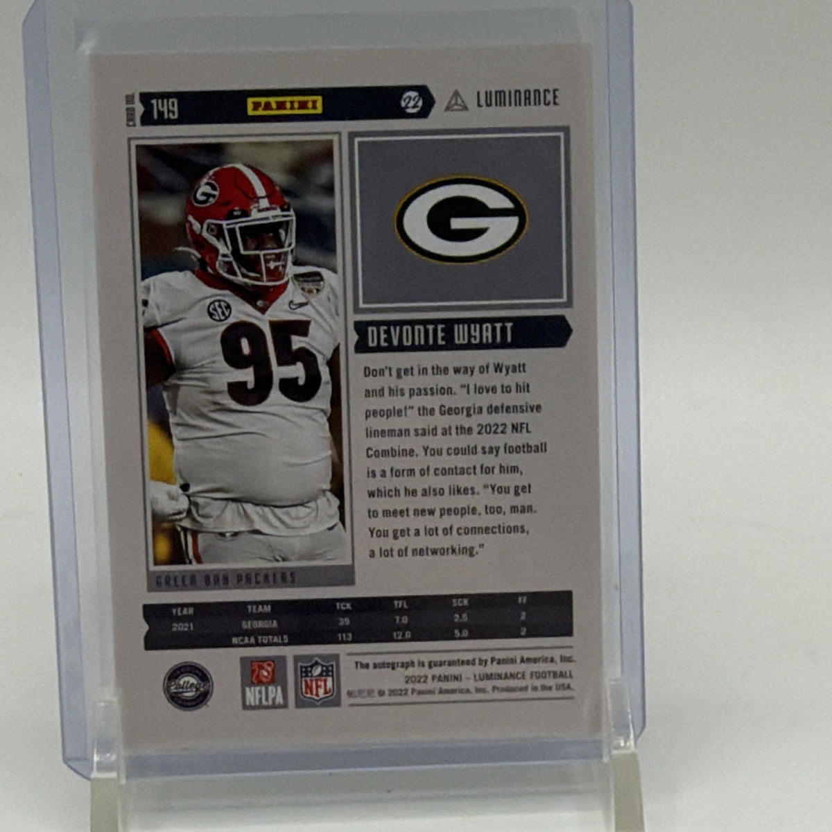 Reverse of 2022 Panini Luminance Devonte Wyatt #149 showing Green Bay Packers information