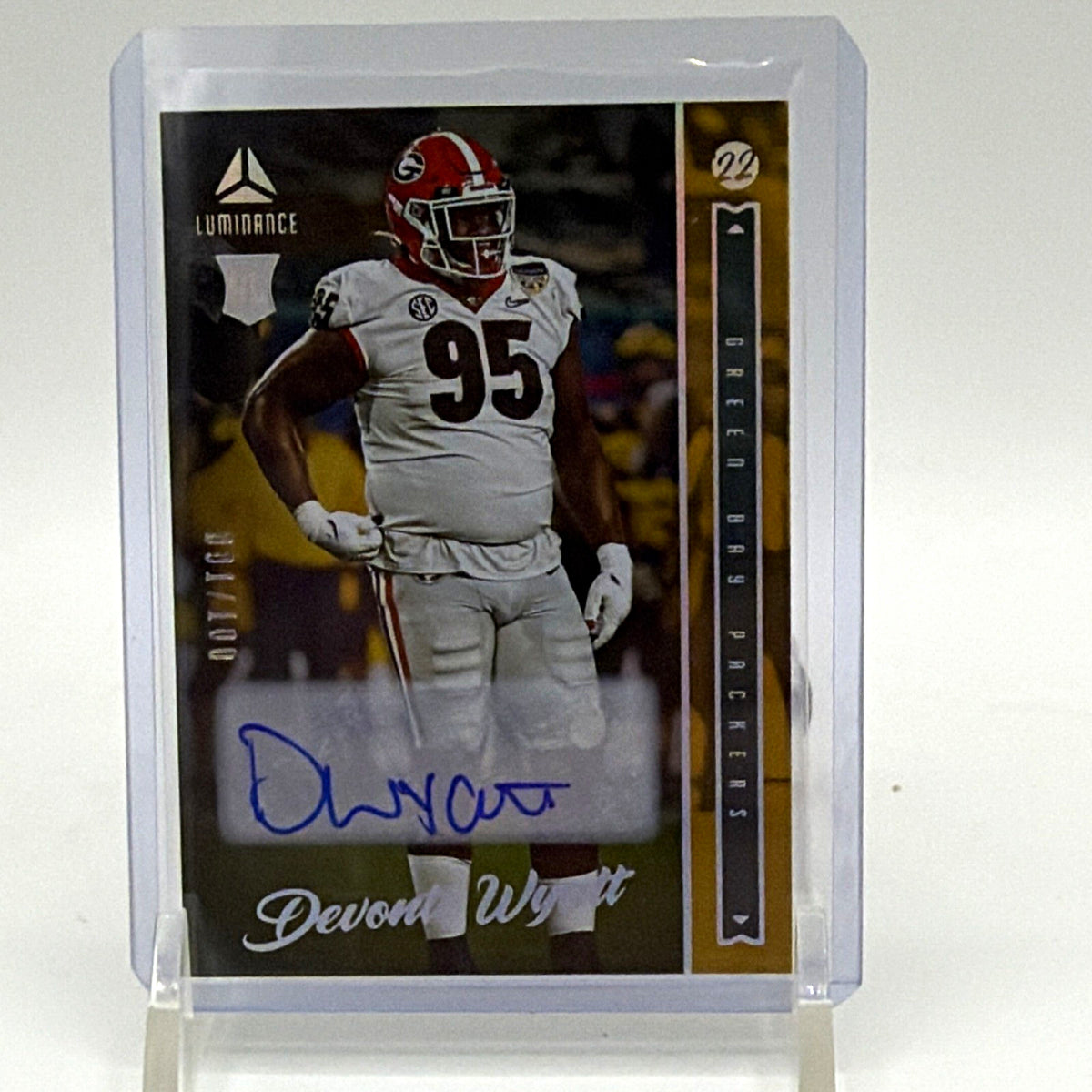 Front of 2022 Panini Luminance Devonte Wyatt rookie autograph card #149, gold parallel numbered 001/100