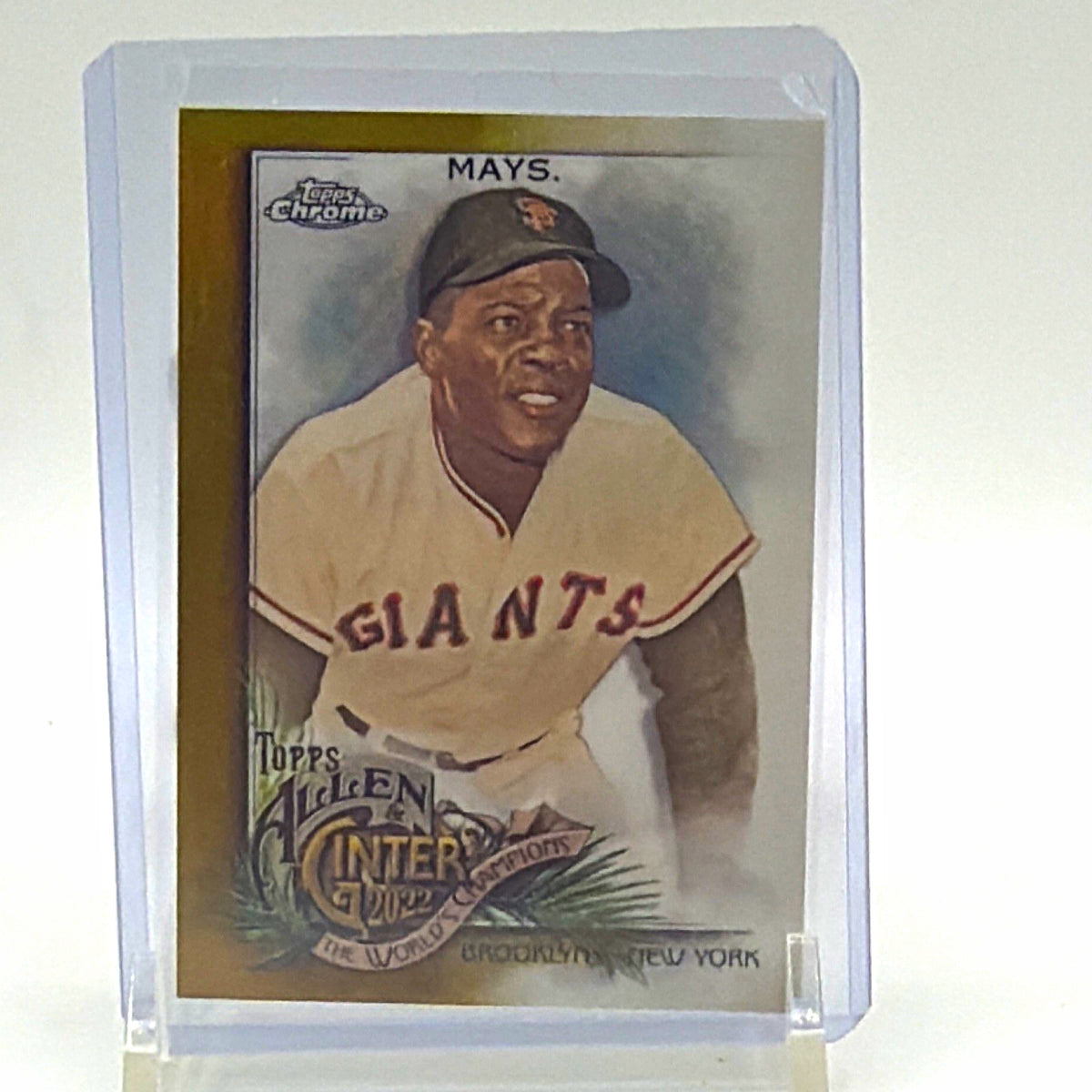 Front of 2022 Topps Allen & Ginter Chrome Willie Mays #64 Gold Refractor baseball card