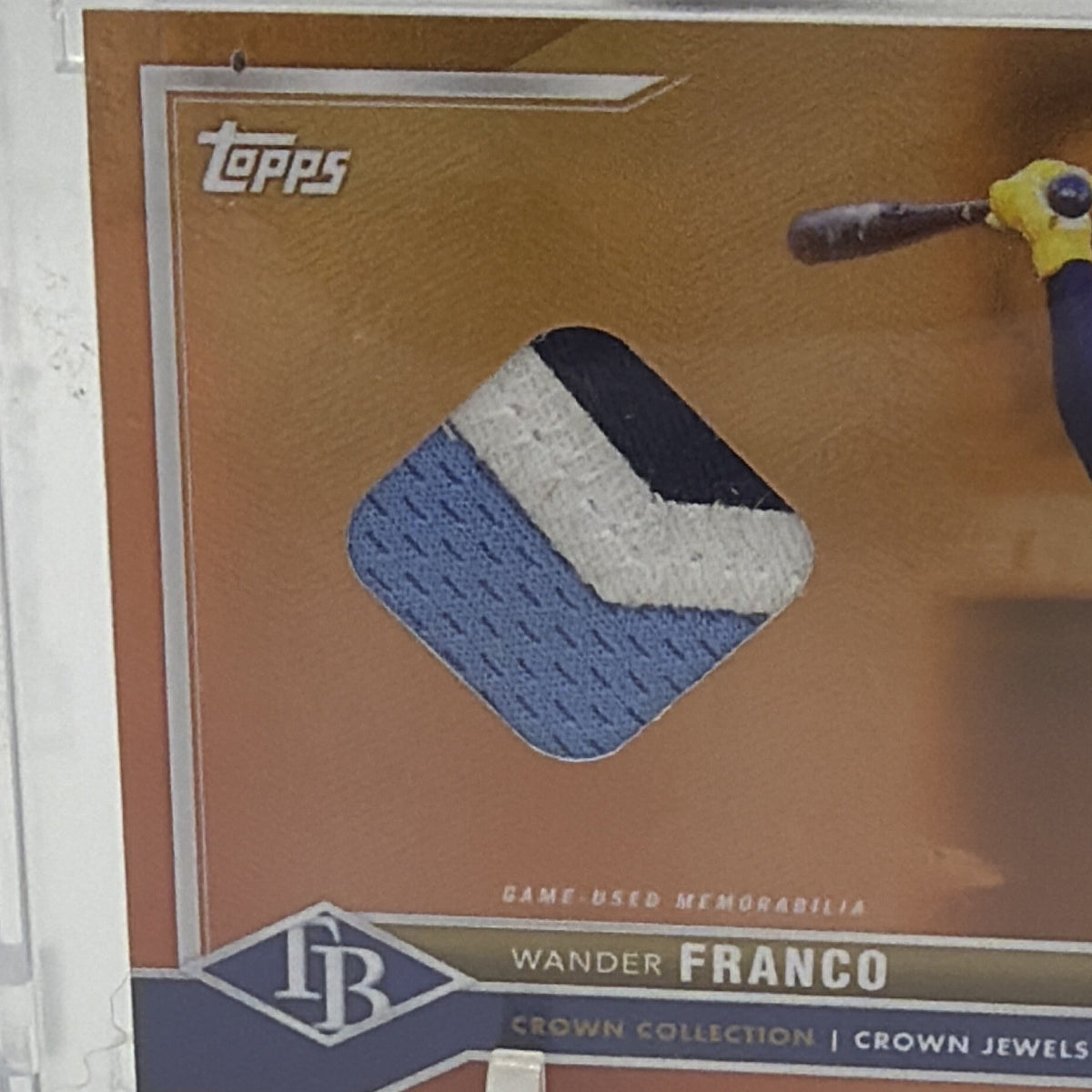 Close-up of two-color memorabilia swatch on Wander Franco Crown Jewel relic card