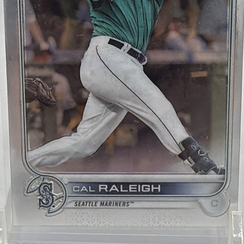 Close-up of lower front of Cal Raleigh #149 rookie card showing his name, Seattle Mariners logo, and rookie designation