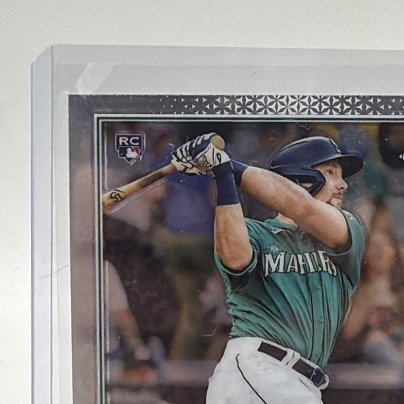 Close-up of upper front of Cal Raleigh 2022 Topps Chrome rookie card showing his batting stance and Chrome border