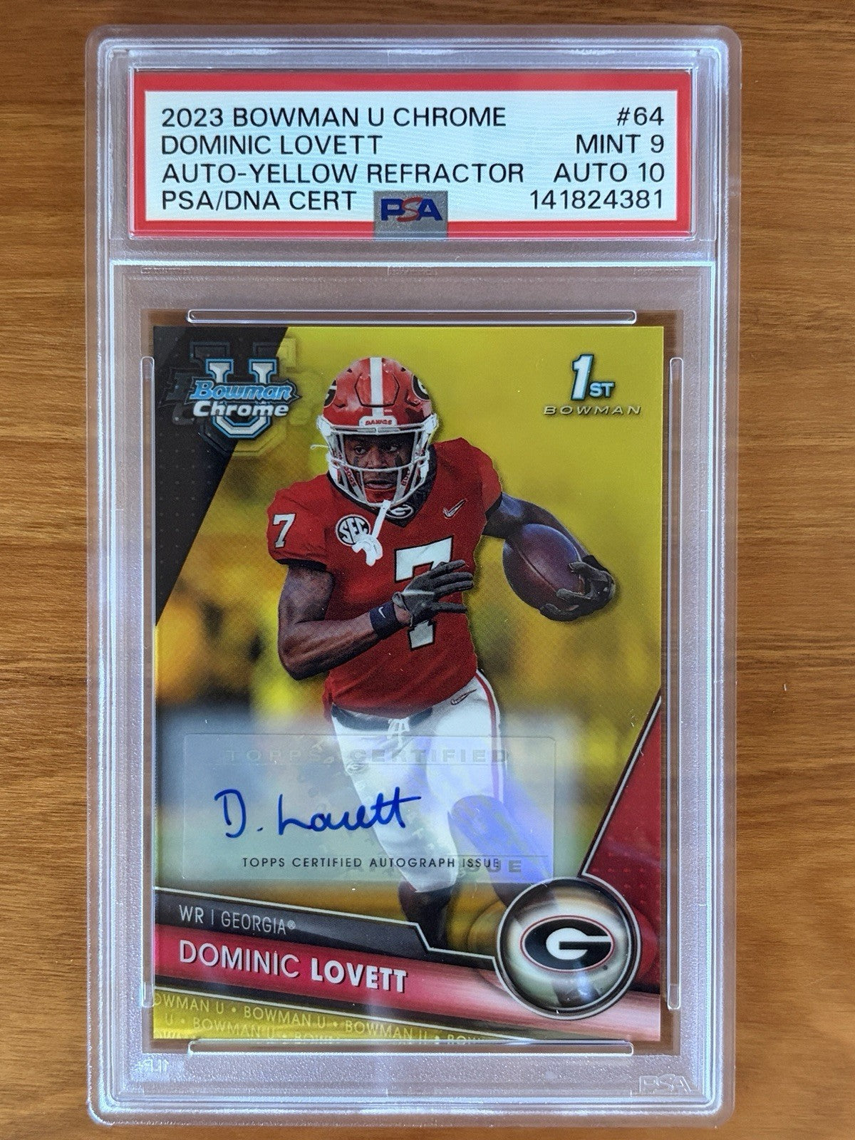 2023 Bowman University Chrome Dominic Lovett Yellow Refractor autograph card numbered to 75 graded PSA 9 with PSA Auto 10 signature. 2023 Bowman University Chrome Dominic Lovett #64 PSA 9 Auto Yellow Refractor /75