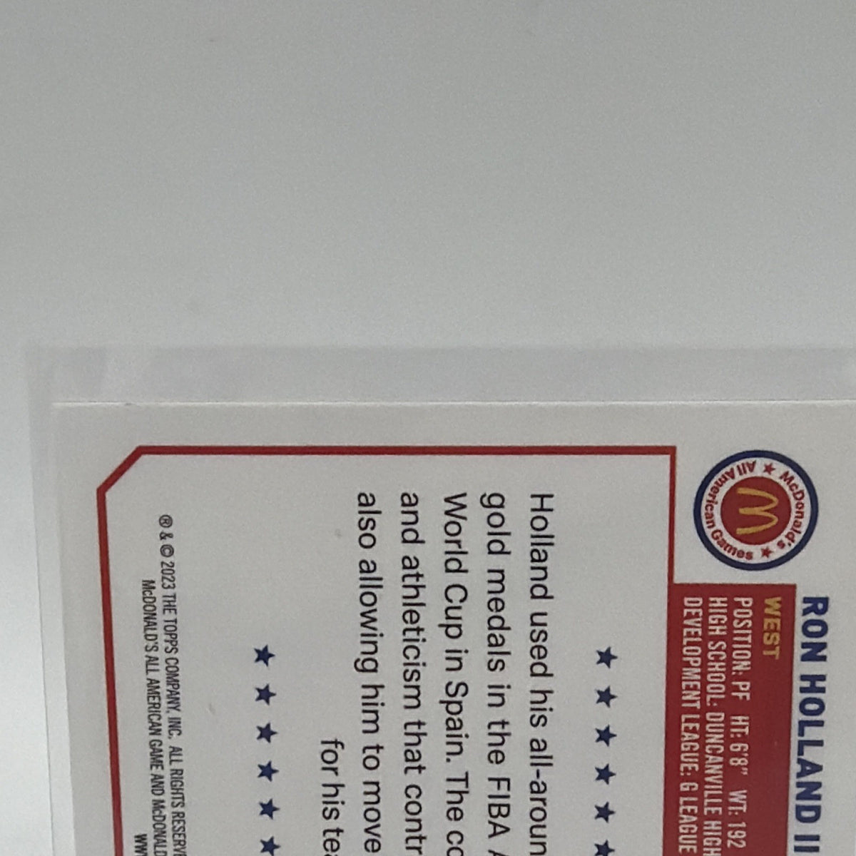 Close-up of the biographical text on the reverse of Ron Holland II basketball card