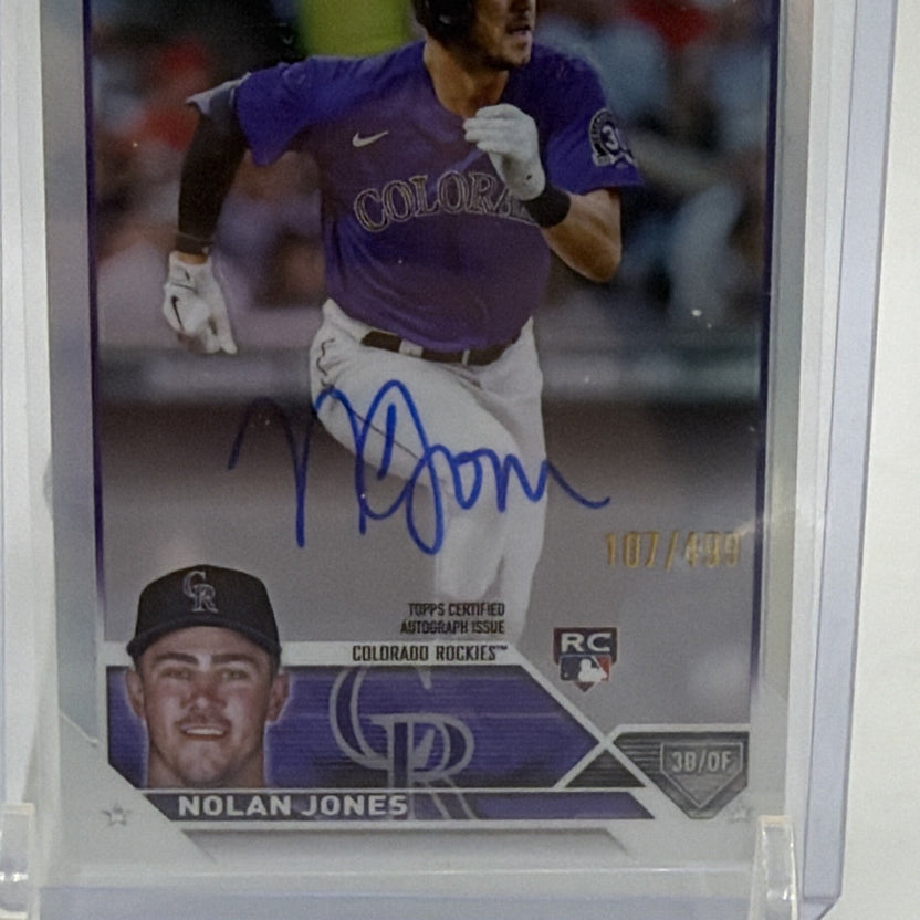 Detail of Nolan Jones rookie card portrait, autograph, and Rockies nameplate