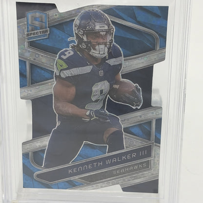 Detail view of 2024 Panini Spectra Kenneth Walker III Neon Blue Die-Cut parallel card showcasing the distinctive die-cut design and Seahawks star running back.