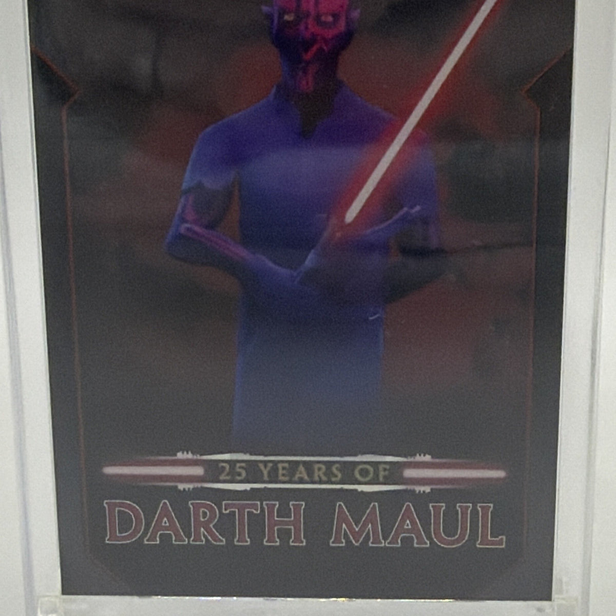 Close-up of Darth Maul holding a red lightsaber on the 2024 Topps Chrome Black 25 Years of Darth Maul insert