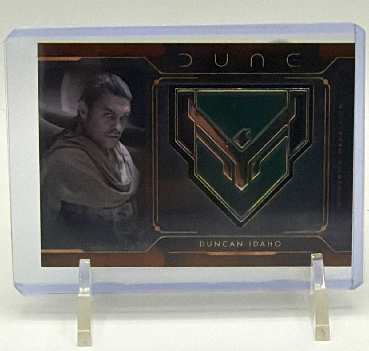Front of 2024 Topps Chrome Dune Duncan Idaho MCM-DI trading card featuring Jason Momoa and House Atreides medallion
