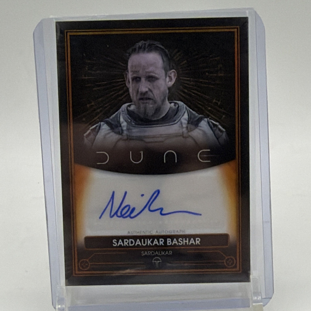 Front of Topps Chrome Dune Neil Bell autograph card A-NB, featuring Sardaukar Bashar portrait and blue signature