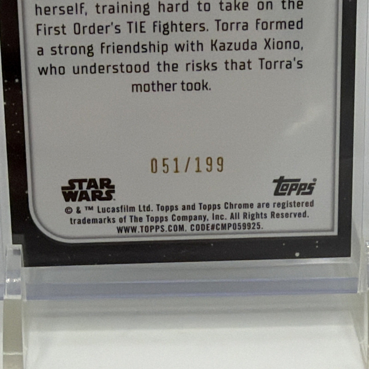 Close-up of Torra Doza trading card serial number 051/199