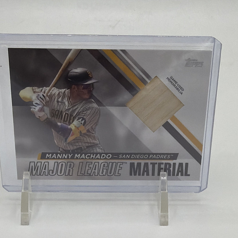 Front of 2024 Topps Series 1 Manny Machado Major League Material #MLM-MM with game-used bat relic