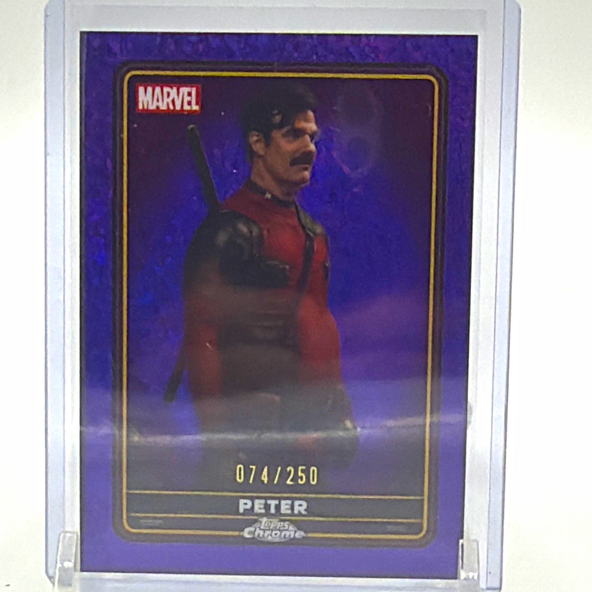 Front of 2025 Topps Chrome Deadpool Peter #23 Purple Wave parallel numbered 074/250