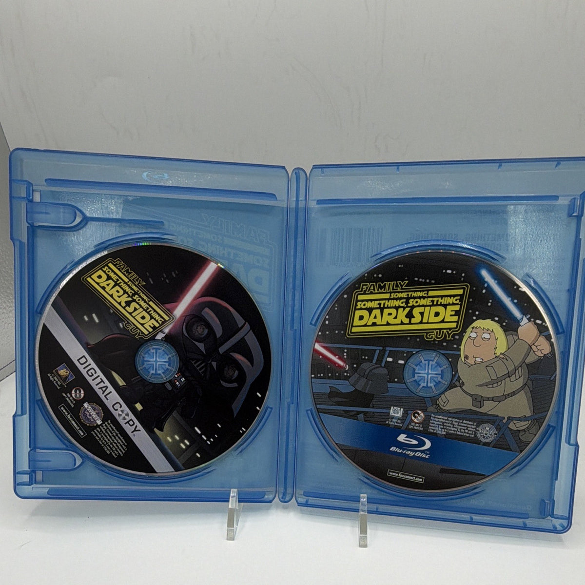 Open Family Guy Something, Something, Something, Dark Side case showing both included physical discs