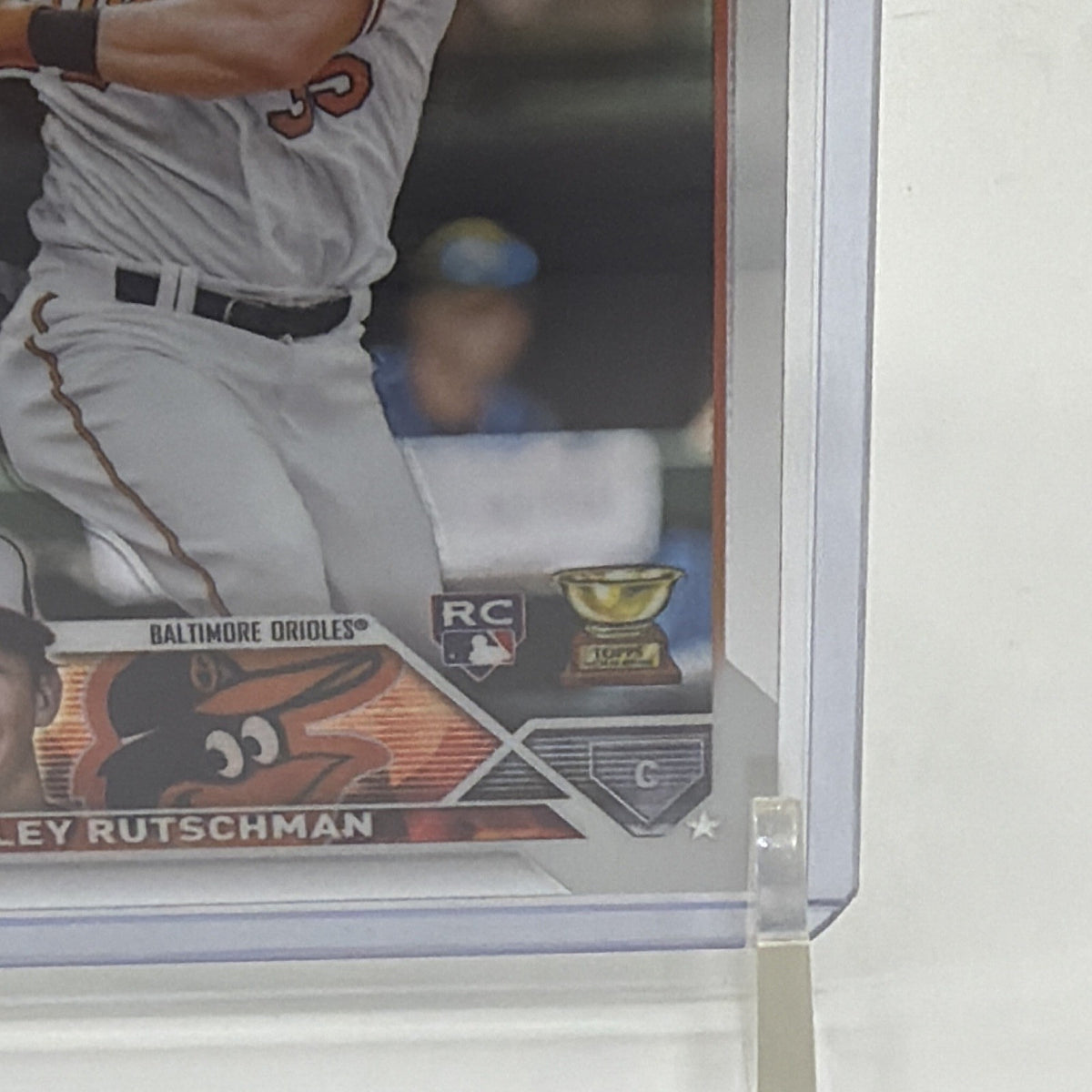 Detail view of Adley Rutschman 2023 Topps Chrome rookie card #1 showing the Orioles nameplate