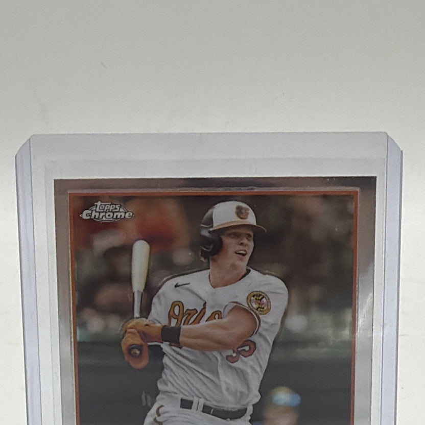 Close-up of Adley Rutschman 2023 Topps Chrome rookie card #1 with RC logo and All-Star Rookie trophy