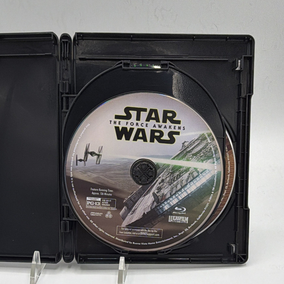 Open Star Wars: The Force Awakens case showing an included feature disc