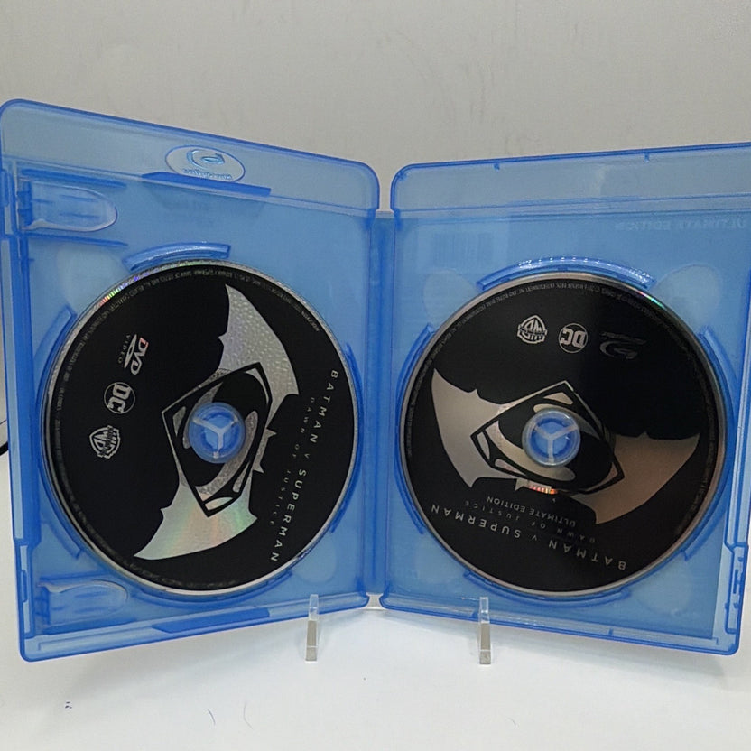 Open Batman v Superman Ultimate Edition case showing both included discs