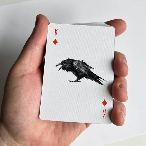 Close-up of a corvid illustration on the King of Diamonds playing card