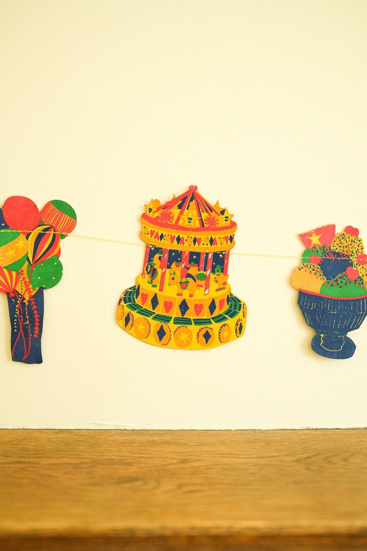 Hand screen printed carousel and balloons from the East End Press sewn garland