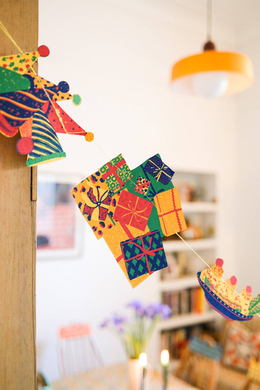 Close-up of colorful hand screen printed birthday shapes from the East End Press garland