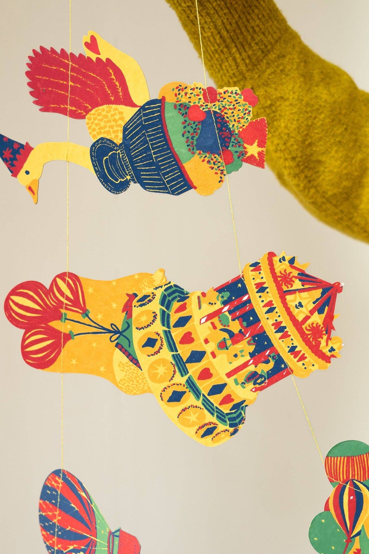 Close-up of colorful hand screen printed birthday shapes from the East End Press garland