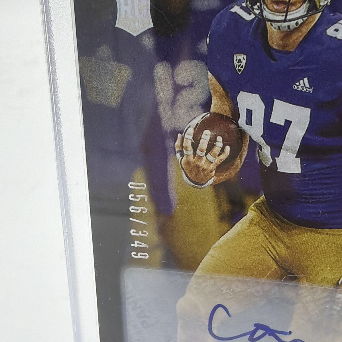 Close-up of Cade Otton Luminance rookie autograph showing the 056/349 serial number