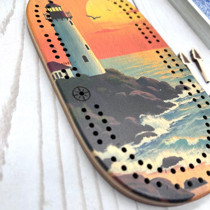 mini travel cribbage board, wilderness cribbage game, pocket cribbage set, Cast and Carve cribbage, wildlife cribbage board, UV printed cribbage board, solid wood cribbage set, eco friendly travel game, Maine-made game board lighthouse