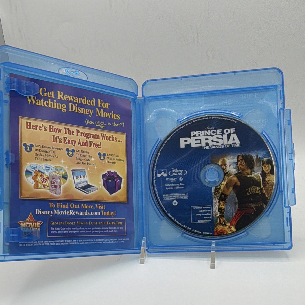Open Prince of Persia Blu-ray case showing the included movie disc and printed insert