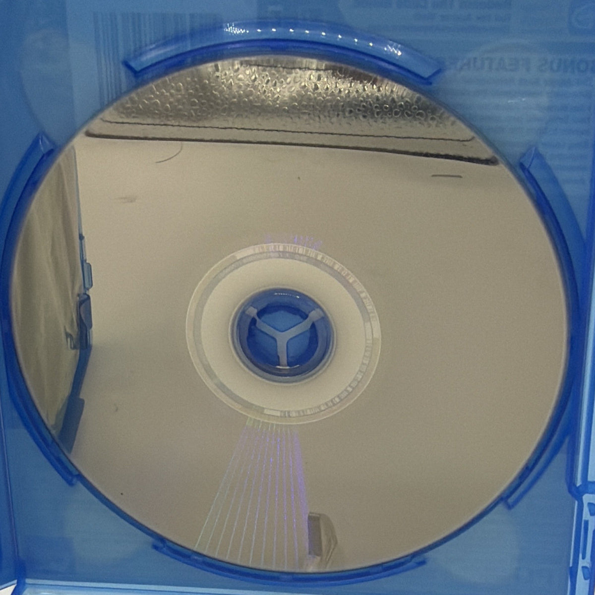 Disney The Jungle Book 2016 Blu-ray disc showing reflective read side