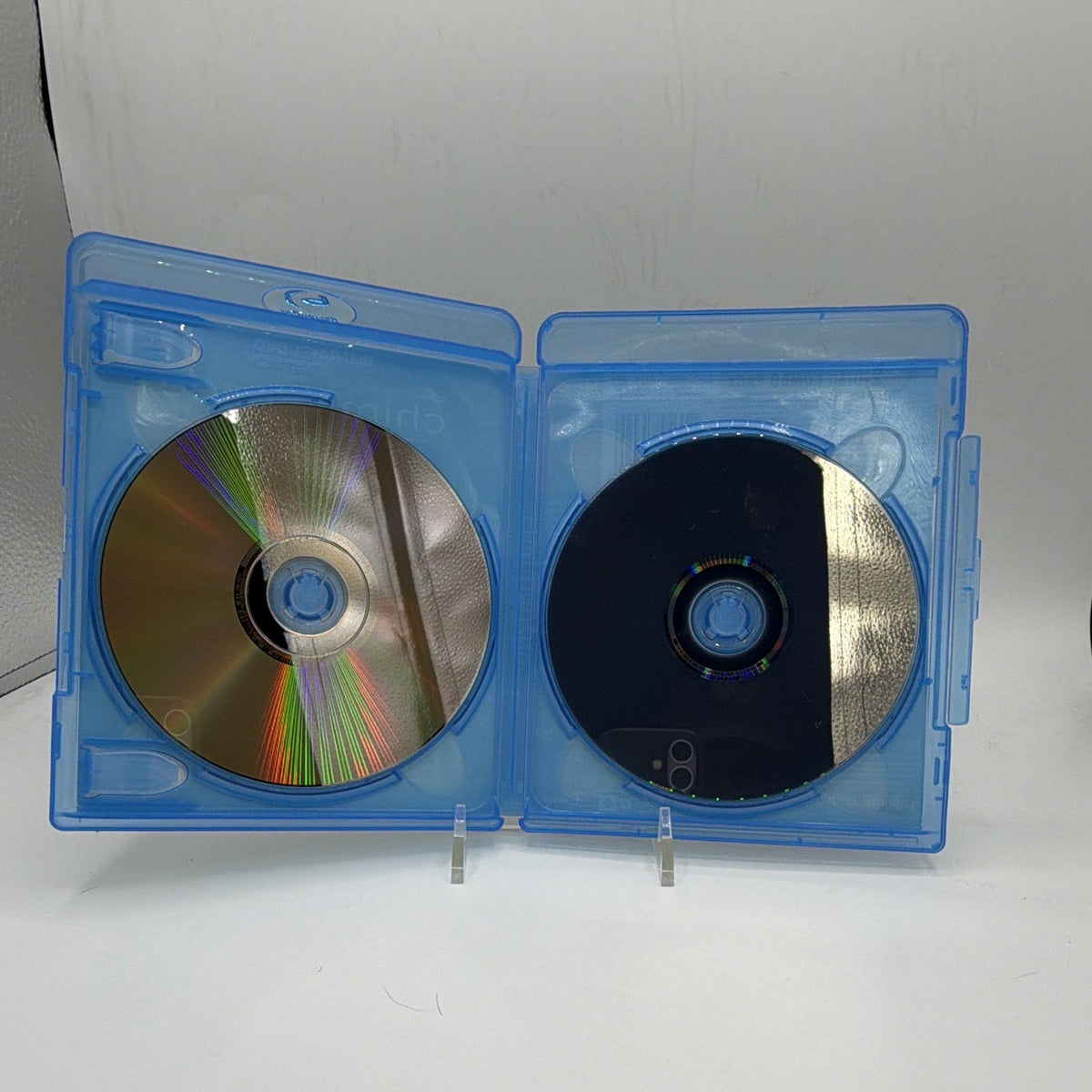 Open Disneynature Chimpanzee case showing the reflective sides of both included discs