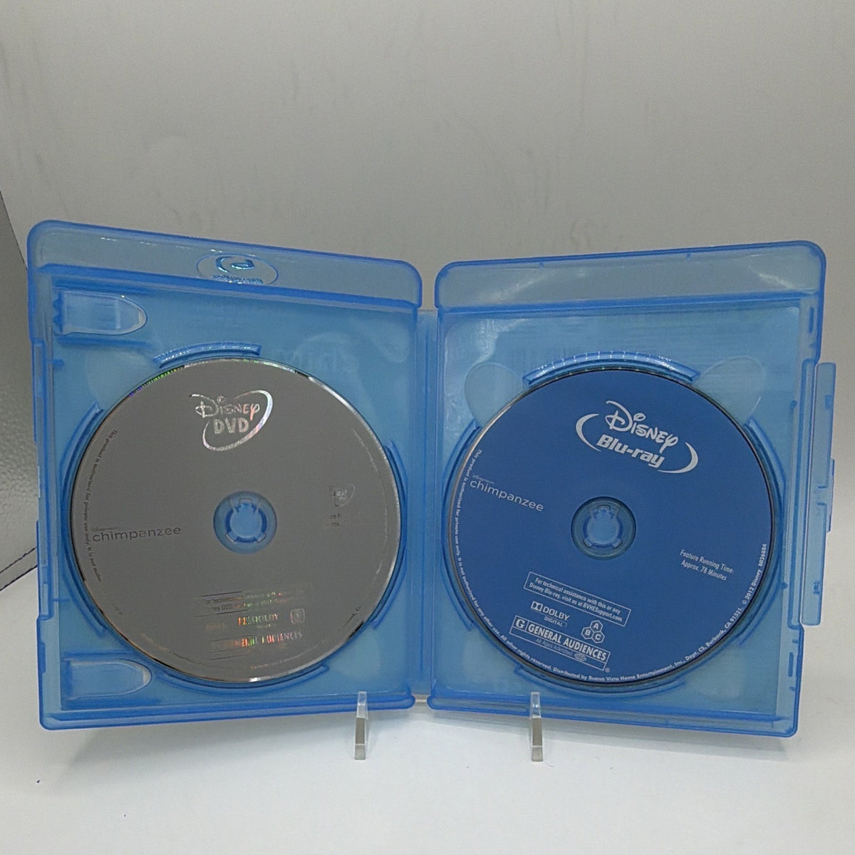 Open Disneynature Chimpanzee case showing the included Blu-ray and DVD discs