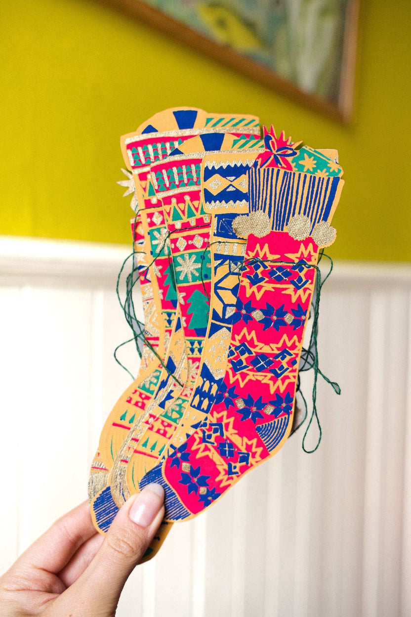 Colorful patterned stockings from the East End Press Festive Stockings Sewn Garland