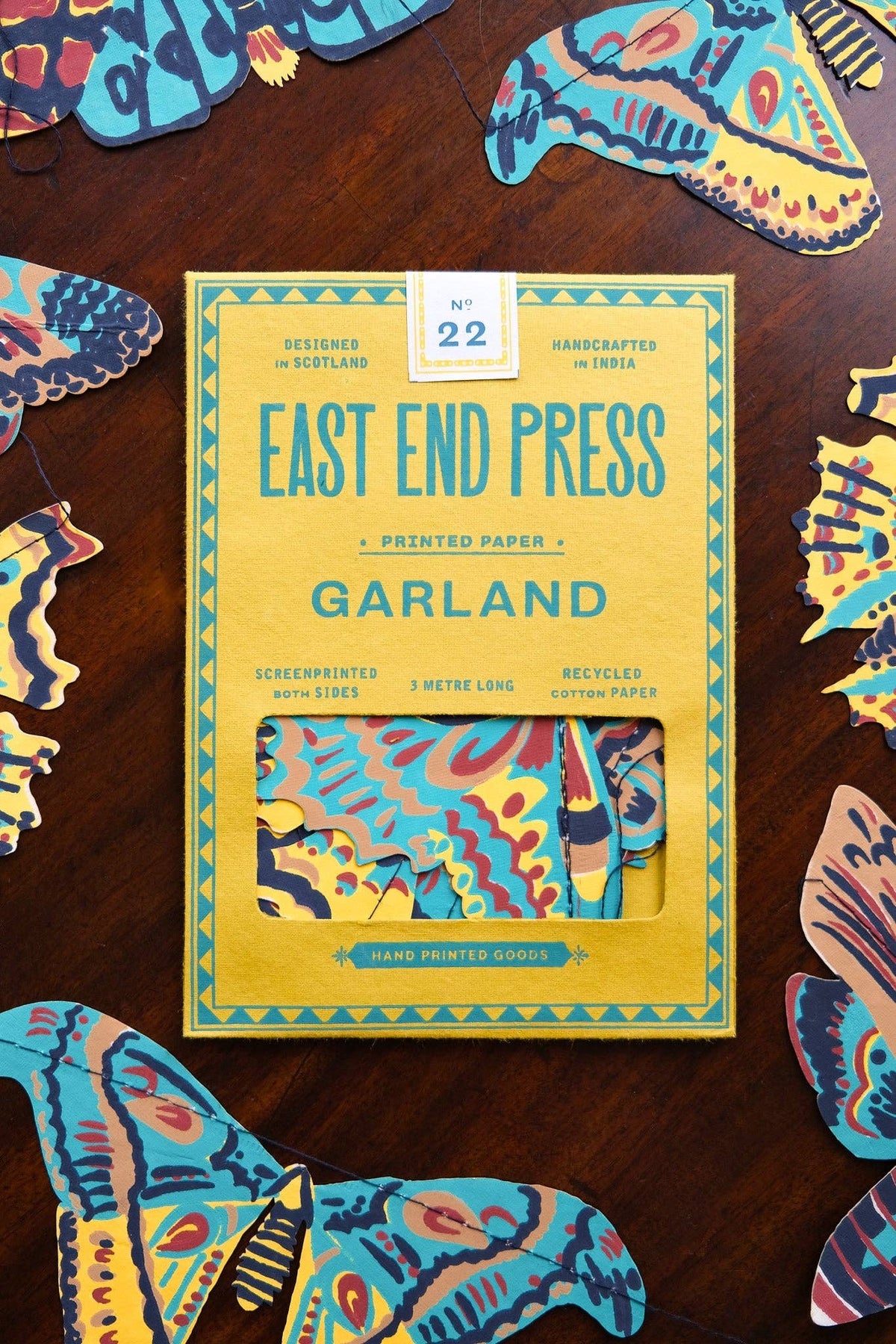 East End Press Moths Garland packaging surrounded by colorful hand printed moth illustrations