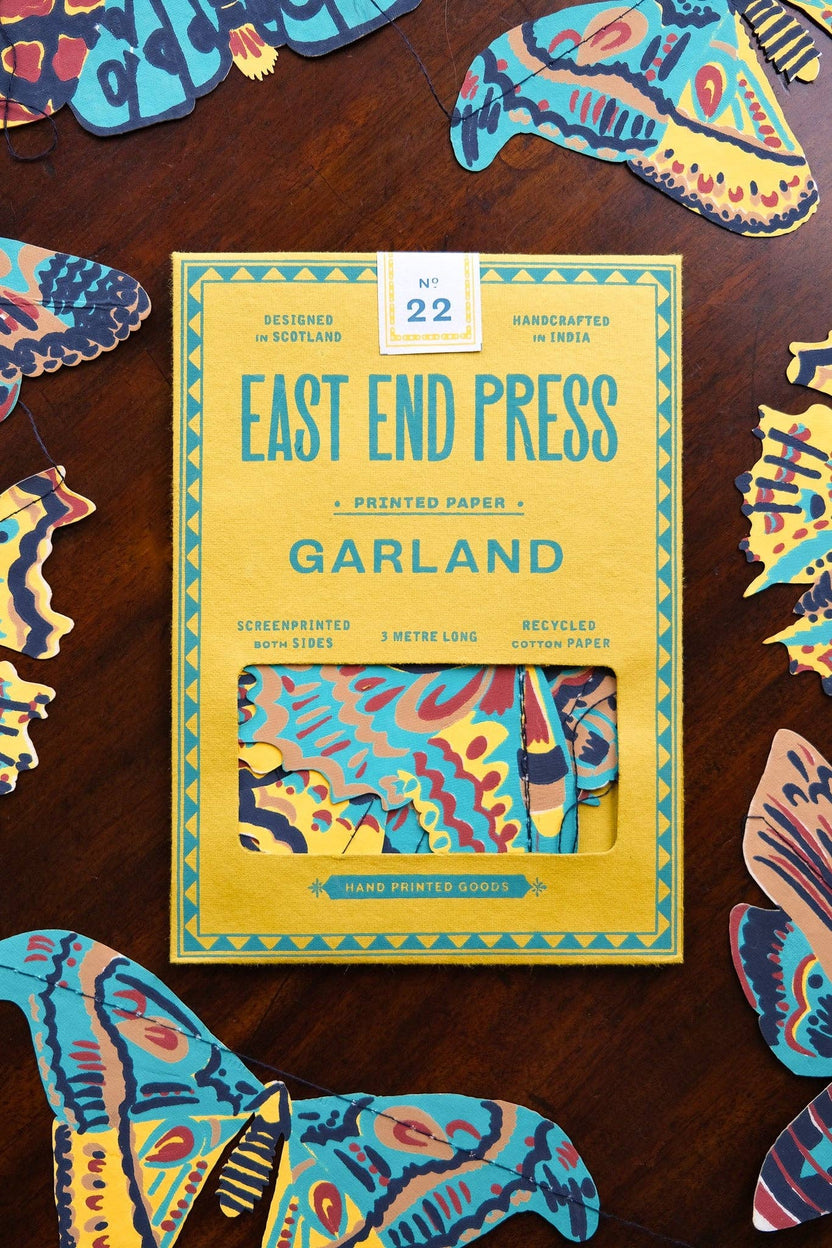 East End Press Moths Garland packaging surrounded by colorful hand printed moth illustrations