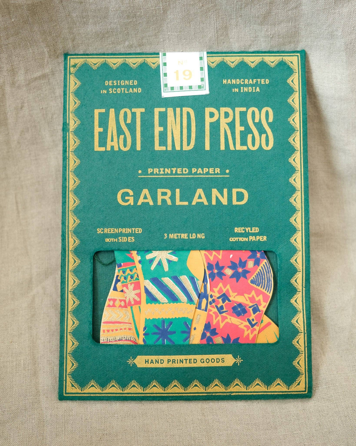 East End Press Festive Stockings Sewn Garland in illustrated packaging