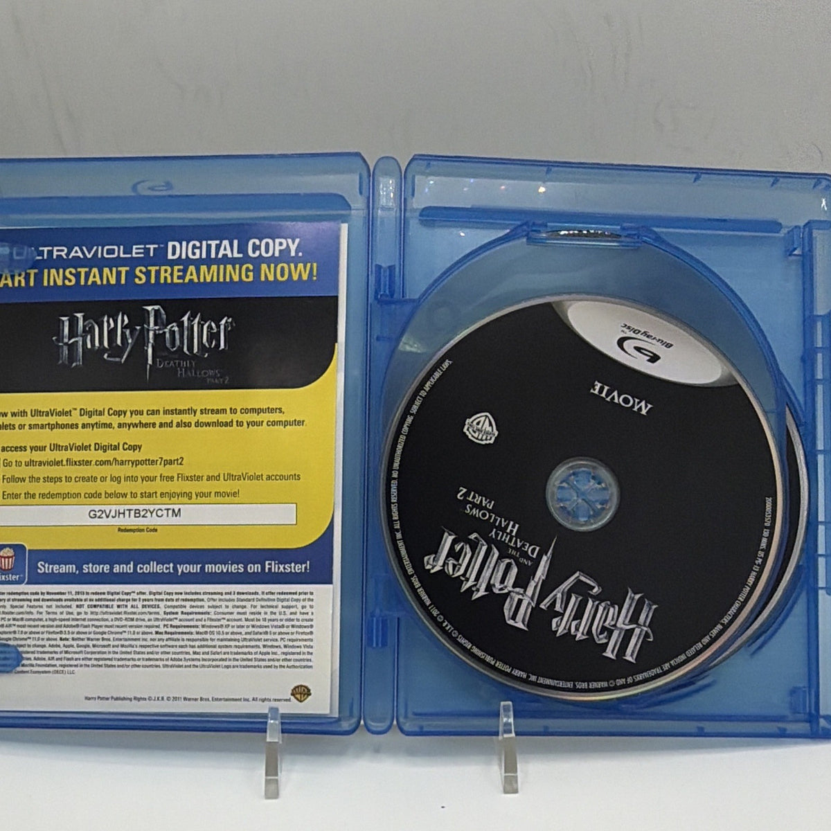 Open Harry Potter and the Deathly Hallows Part 2 case showing the movie disc and Digital Copy insert