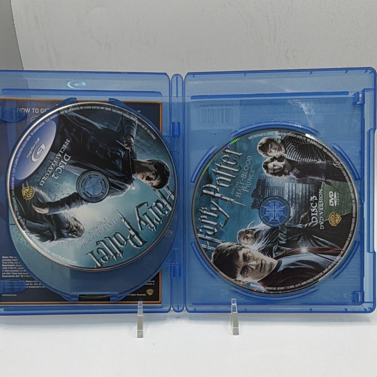 Open Harry Potter and the Half-Blood Prince case showing both included physical discs