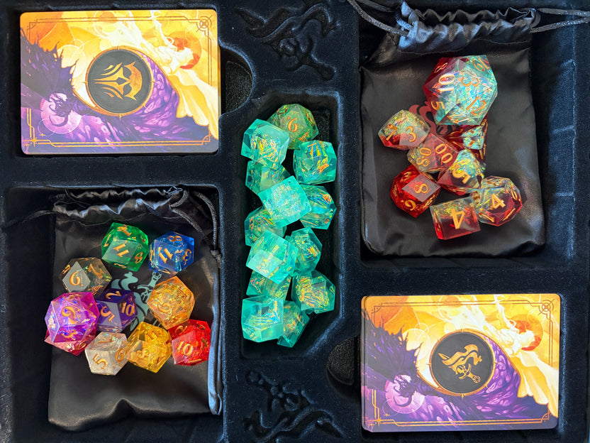 Close-up of premium Hope, Fear, and polyhedral dice, and Fear Trackers included with the Daggerheart Hope & Fear Deluxe Edition.