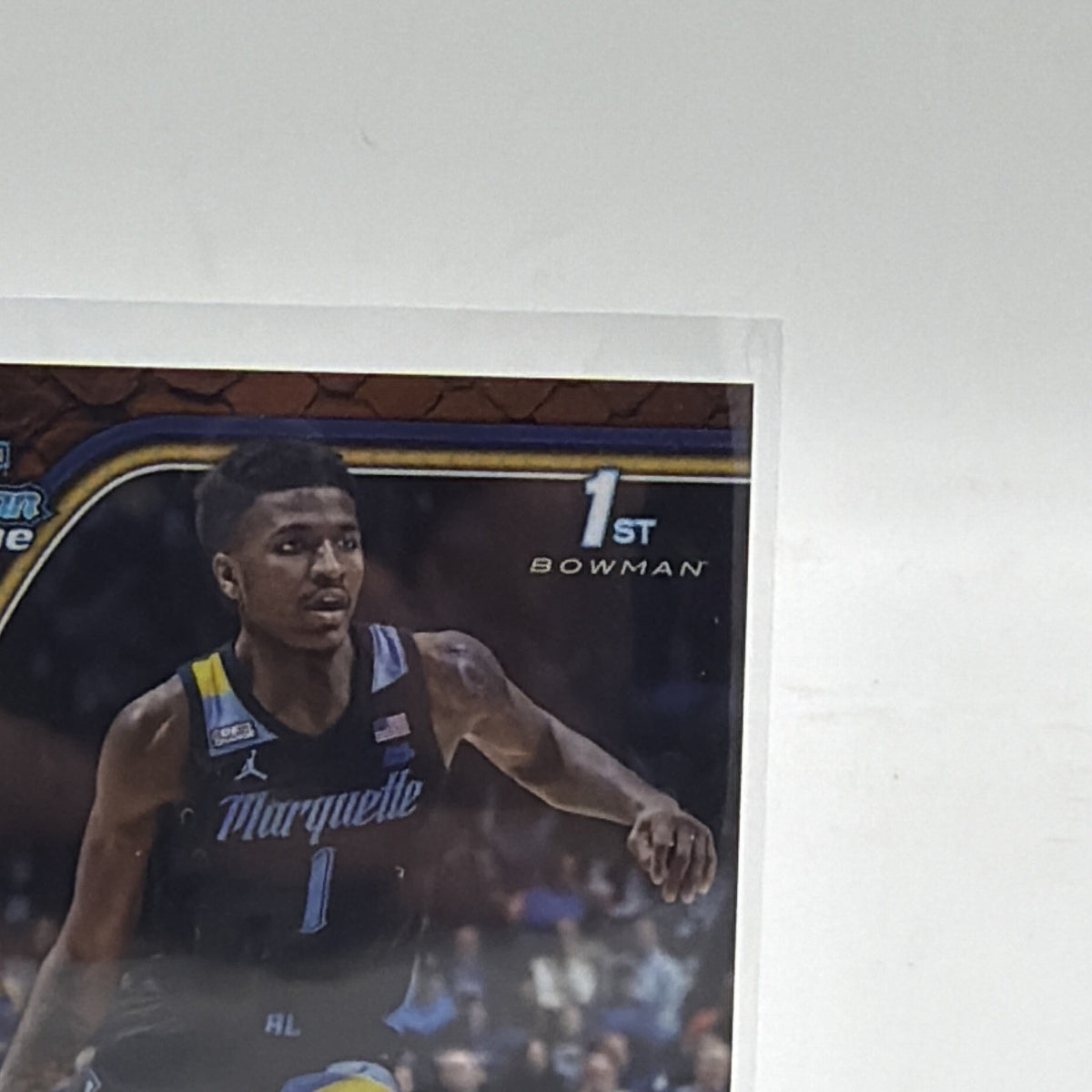 Close-up of Kam Jones 2024-25 Bowman Chrome University Orange Reptilian Refractor #39 numbered 9/25