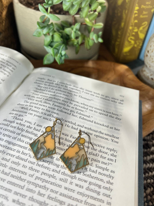 landscape earrings, stained glass resin earrings, brass mountain earrings, lightweight statement earrings, handmade scenic earrings, nature inspired jewelry, outdoorsy earrings for women, wilderness earrings, forest jewelry, gift for hikers, boho landscape earrings, artisan resin earrings, unique brass earrings, Wild & Scenic jewelry, colorful resin earrings, modern nature earrings, handcrafted earrings USA, Rogue & Rye earrings, mountain jewelry, everyday adventure accessories