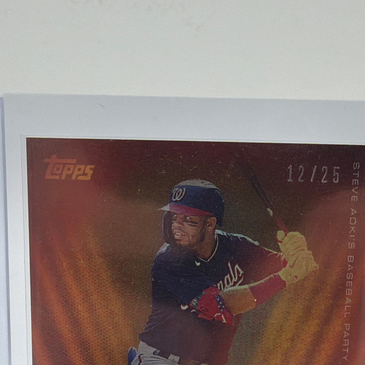 Close-up of Luis Garcia Gold Burst autograph showing 12/25 serial number and gold-orange design